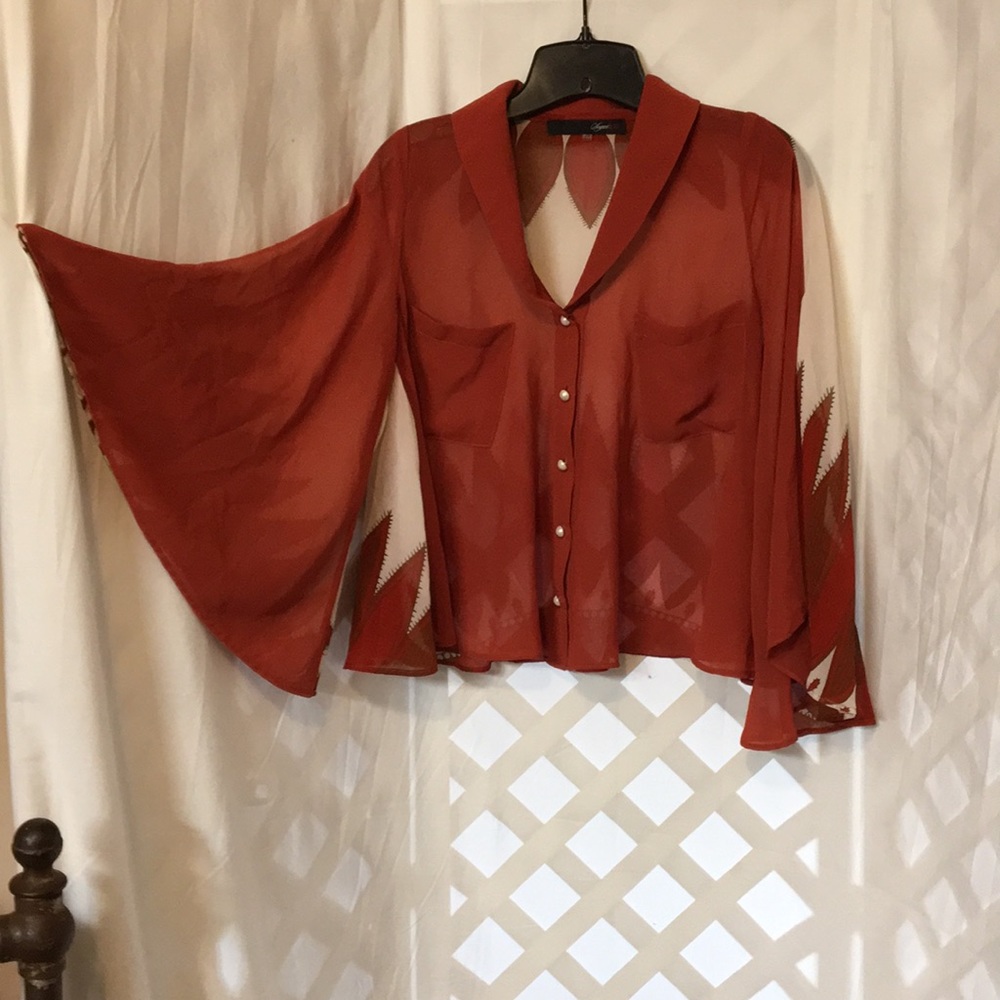 Shear flowy blouse.